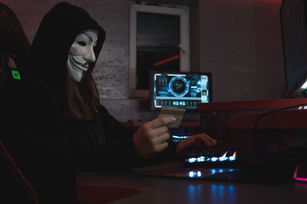 woman-in-black-hoodie-holding-a-bank-card-5380665-1024x682